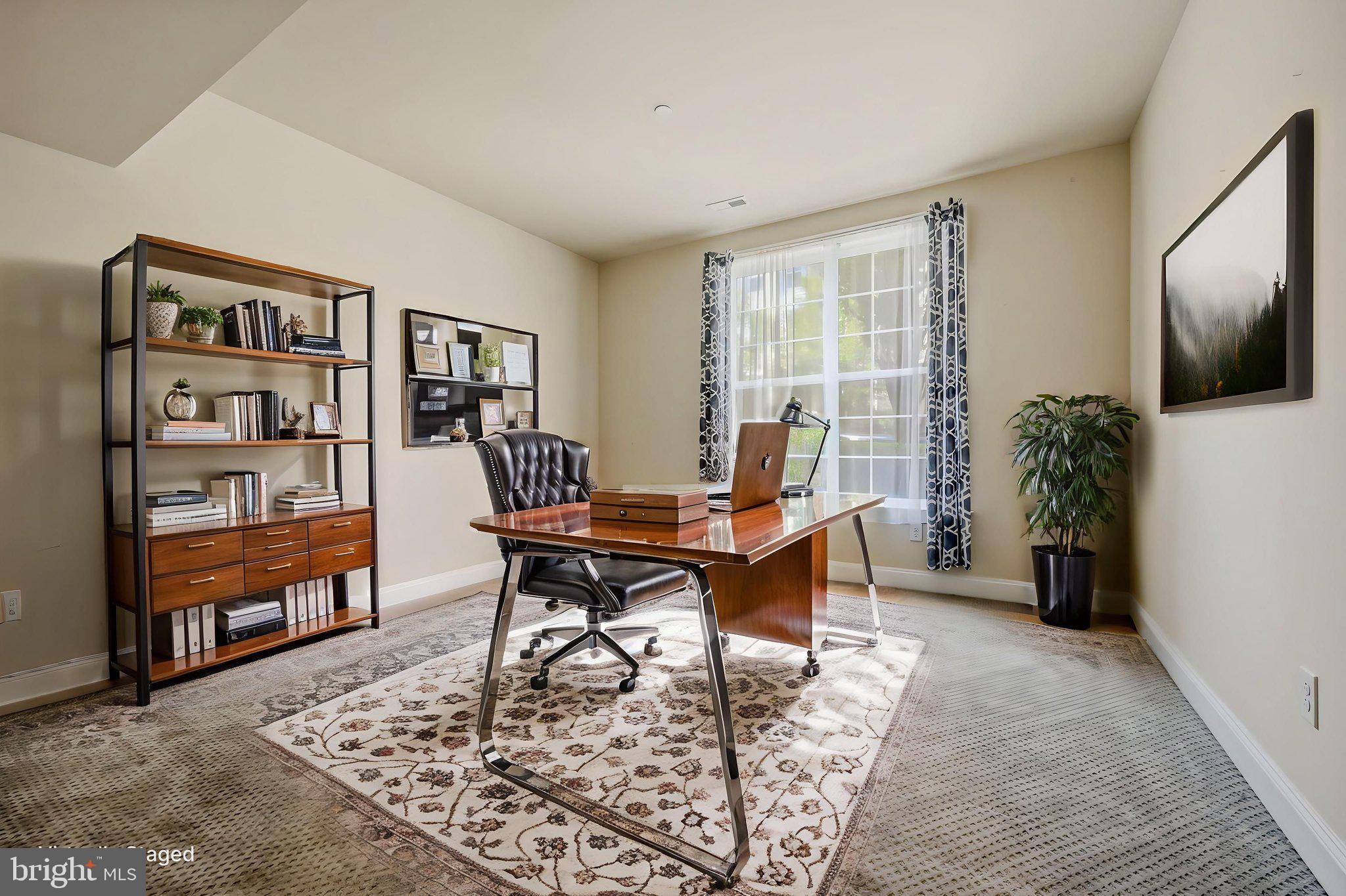 208 Jackdaw Alley, Unit 208 Springfield, PA 19064 - Photo 8 of 49 a workspace with furniture and a potted plant