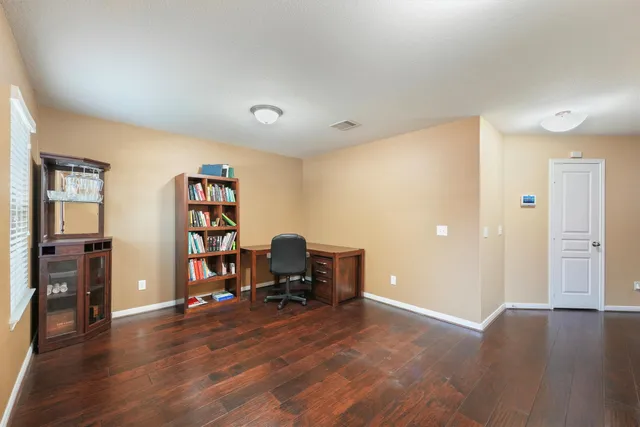 a view of a livingroom with furniture and wooden floor