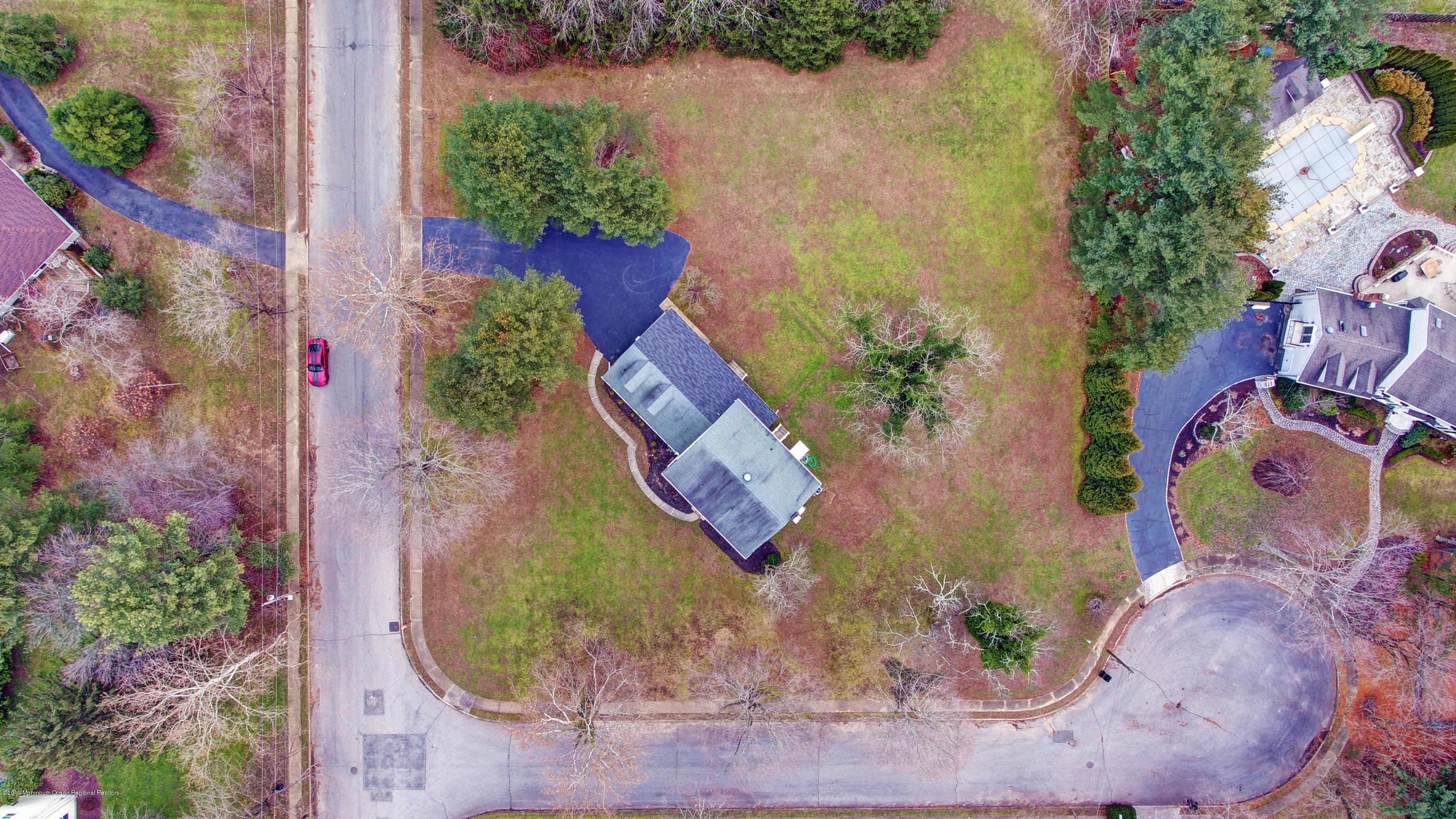 91 Stavola Road Middletown, NJ 07748 - Photo 54 of 54 an aerial view of a house with a yard and garden