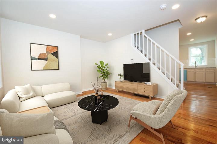 114 Brookfield Terrace Ardmore, PA 19003 - Photo 1 of 13 a living room with furniture and a flat screen tv
