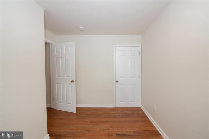 114 Brookfield Terrace Ardmore, PA 19003 - Photo 12 of 13 a view of an empty room with wooden floor