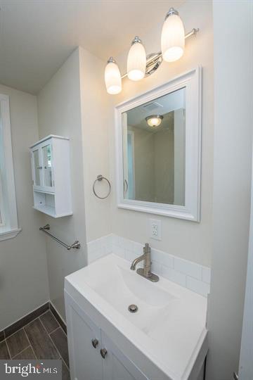 114 Brookfield Terrace Ardmore, PA 19003 - Photo 10 of 13 a bathroom with a sink a toilet and mirror