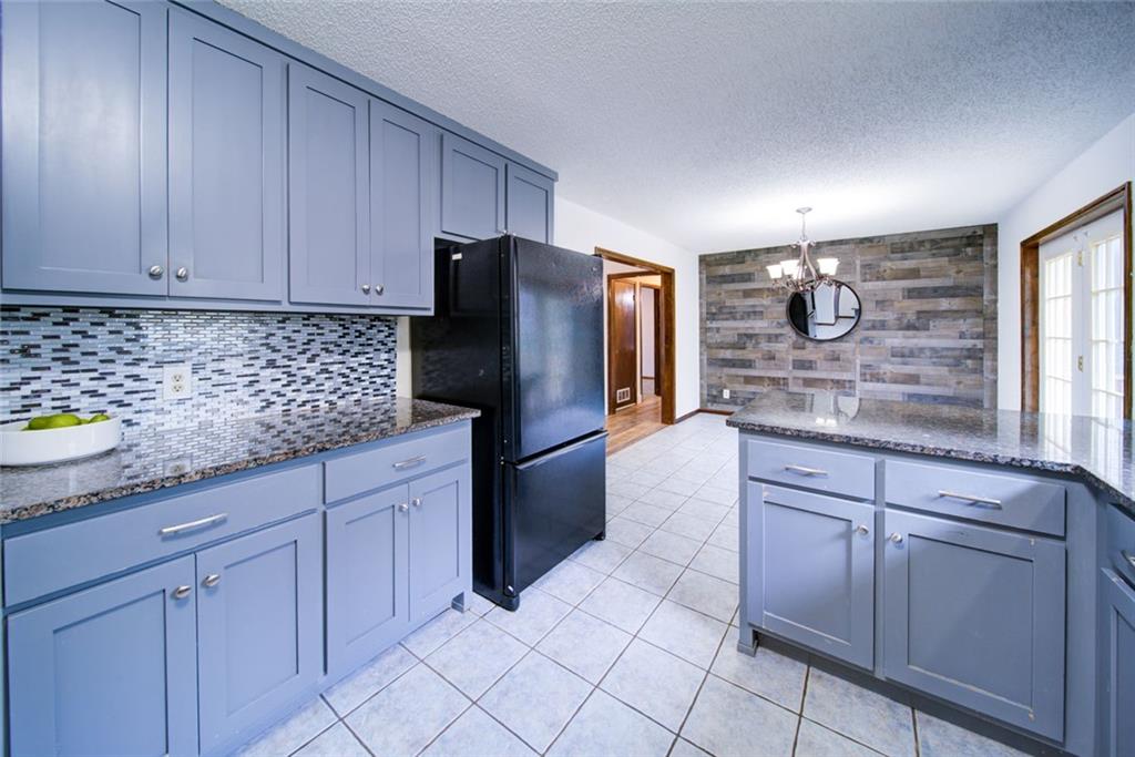 2976 Sweetwater Juno Road Dawsonville, GA 30534 - Photo 11 of 42 a kitchen with stainless steel appliances granite countertop a refrigerator and a sink