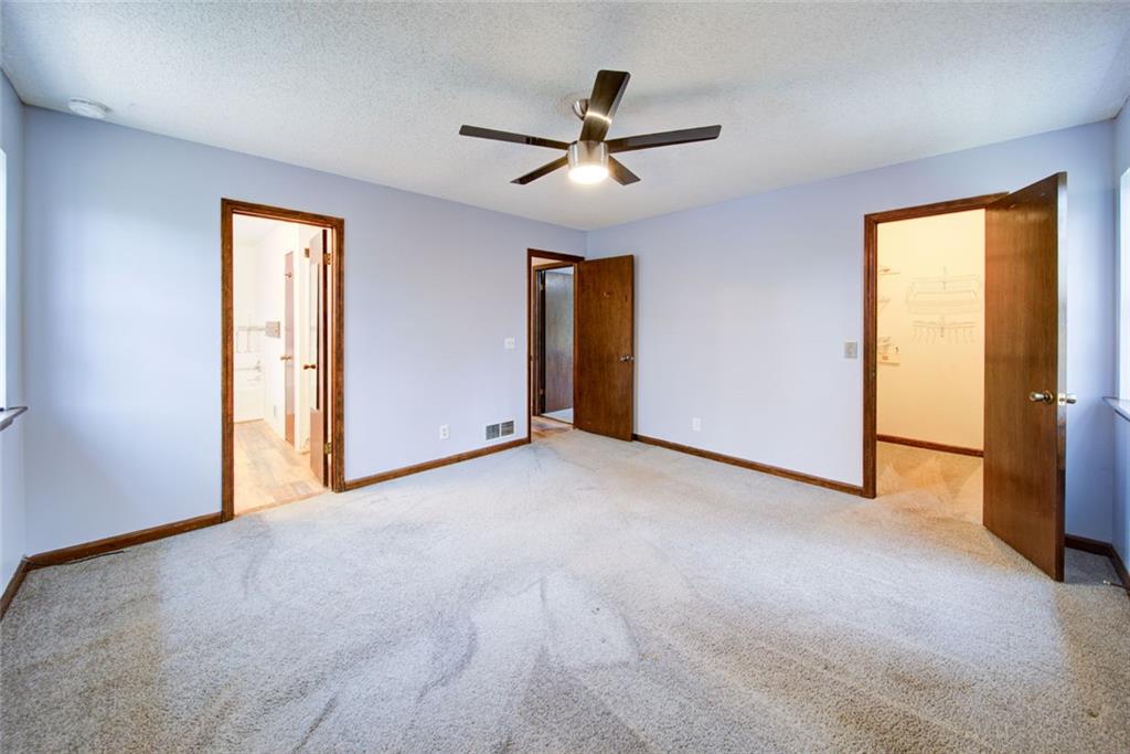 2976 Sweetwater Juno Road Dawsonville, GA 30534 - Photo 19 of 42 a view of a livingroom with a ceiling fan & windows