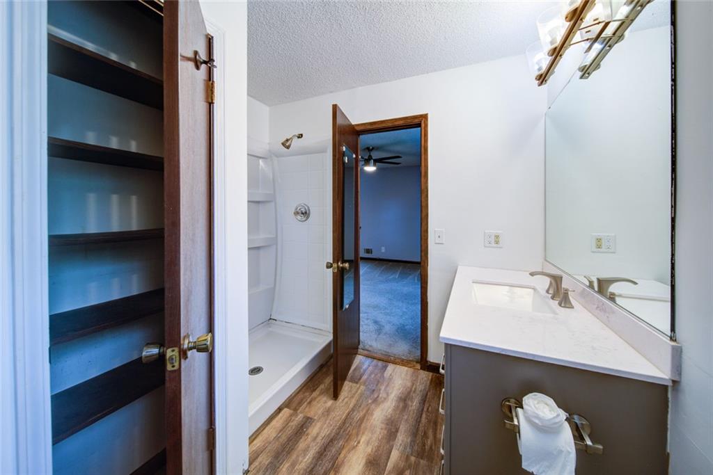 2976 Sweetwater Juno Road Dawsonville, GA 30534 - Photo 21 of 42 a en suite bathroom with a sink and a mirror