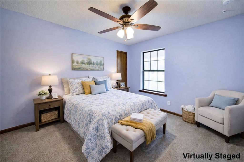 2976 Sweetwater Juno Road Dawsonville, GA 30534 - Photo 23 of 42 a bedroom with bed and window