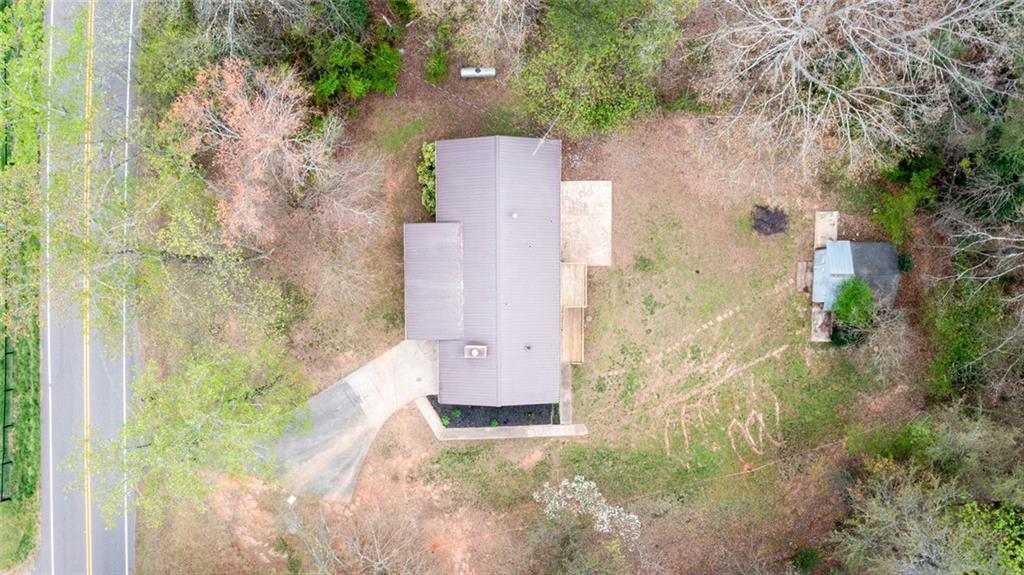 2976 Sweetwater Juno Road Dawsonville, GA 30534 - Photo 3 of 42 aerial view of a house with a yard and large trees