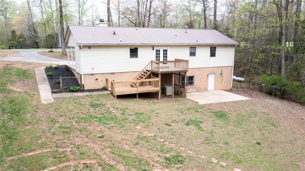 2976 Sweetwater Juno Road Dawsonville, GA 30534 - Photo 36 of 42 a view of a house with backyard and sitting area