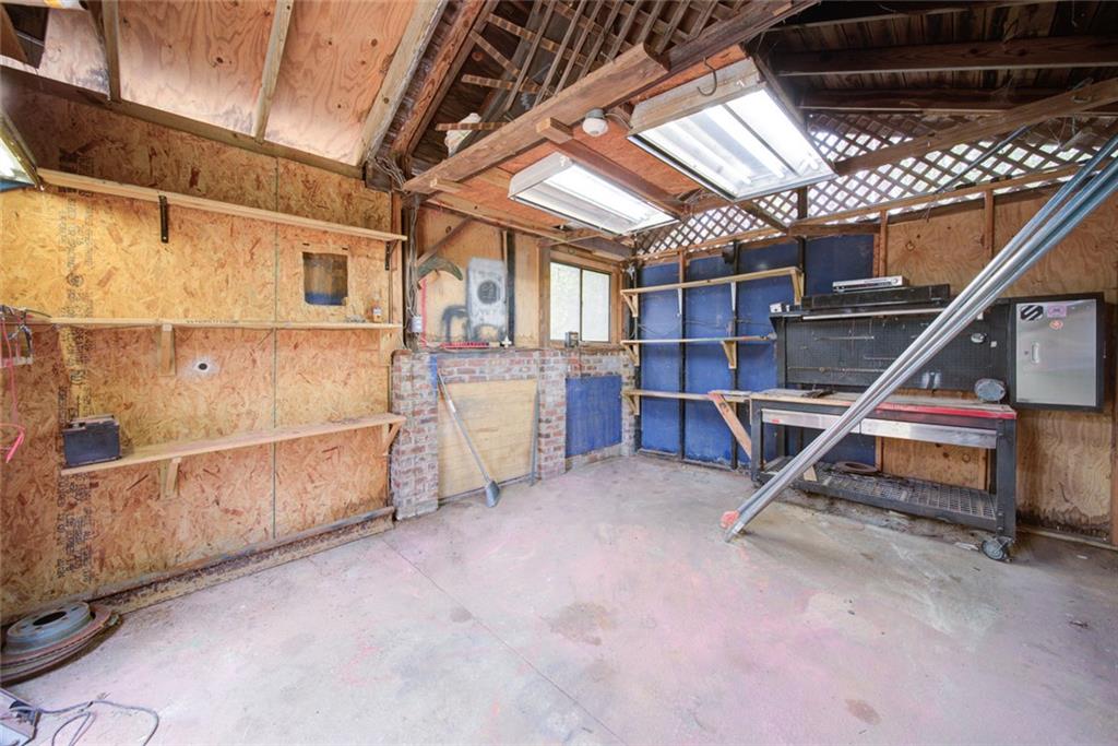 2976 Sweetwater Juno Road Dawsonville, GA 30534 - Photo 39 of 42 a view of a storage room with wooden floor