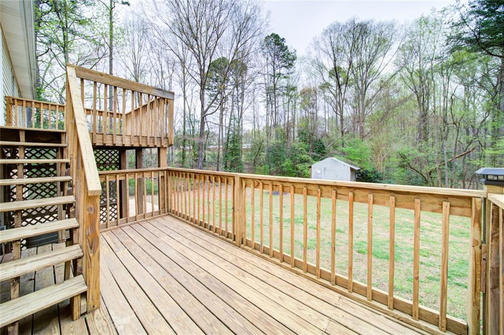 2976 Sweetwater Juno Road Dawsonville, GA 30534 - Photo 40 of 42 a view of balcony with wooden floor and fence
