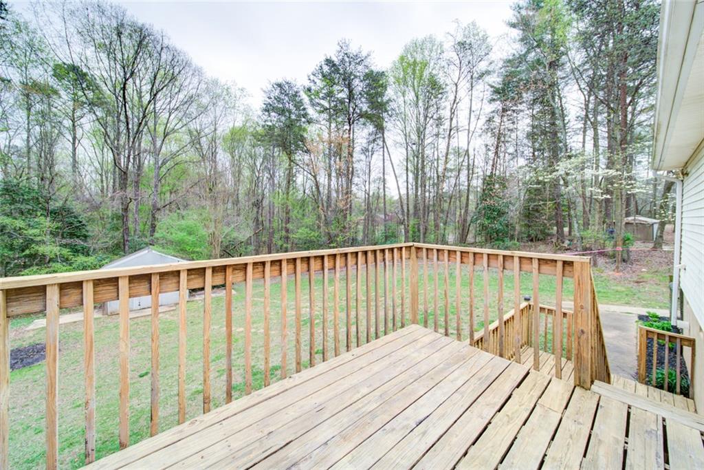 2976 Sweetwater Juno Road Dawsonville, GA 30534 - Photo 41 of 42 a view of balcony with wooden floor and fence