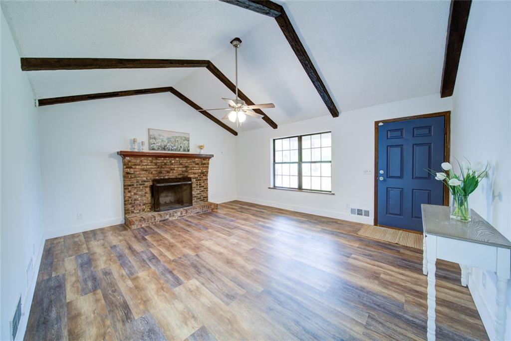 2976 Sweetwater Juno Road Dawsonville, GA 30534 - Photo 6 of 42 a view of empty room with wooden floor and fan