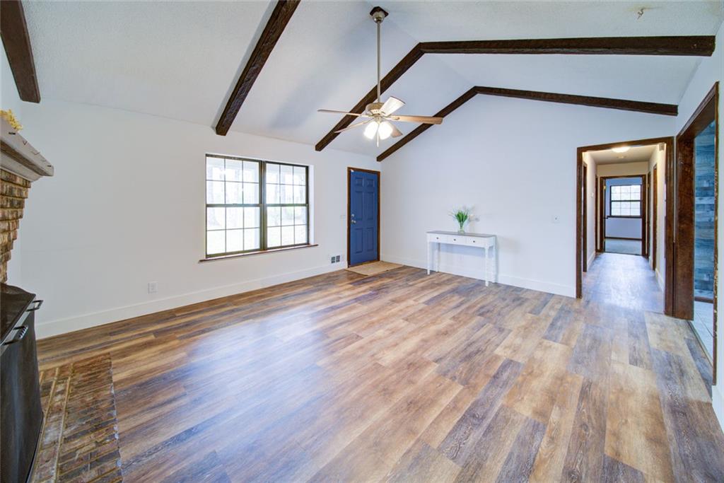 2976 Sweetwater Juno Road Dawsonville, GA 30534 - Photo 7 of 42 a view of empty room with wooden floor and fan