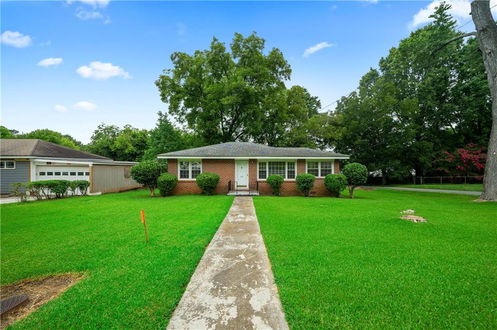 200 Flora Avenue Southeast Rome, GA 30161 - Photo 1 of 1 a front view of a house with a garden