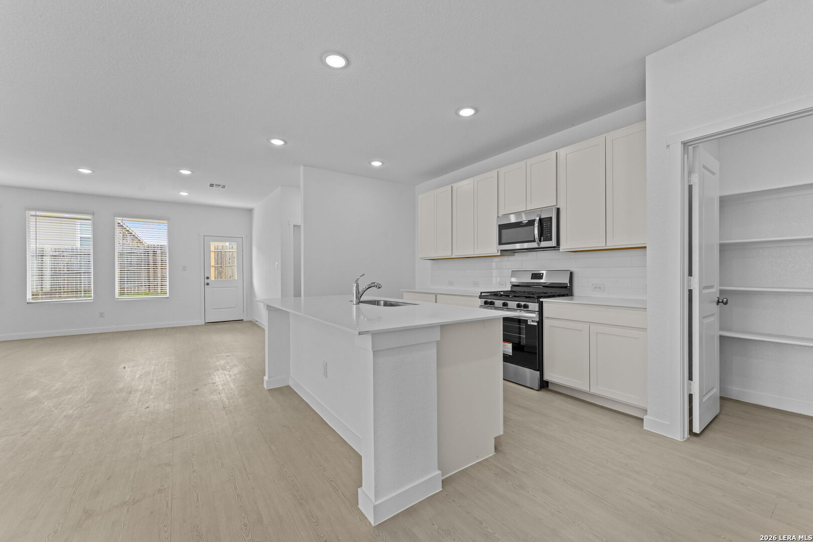 2323 Fort Davis Pass Marion, TX 78124 - Photo 17 of 30 a kitchen with white cabinets and stainless steel appliances