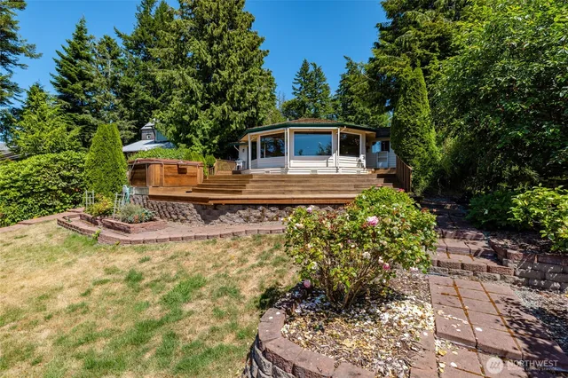 a view of balcony with wooden floor