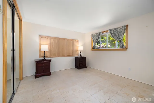 a view of a bathroom with a shower and a tub