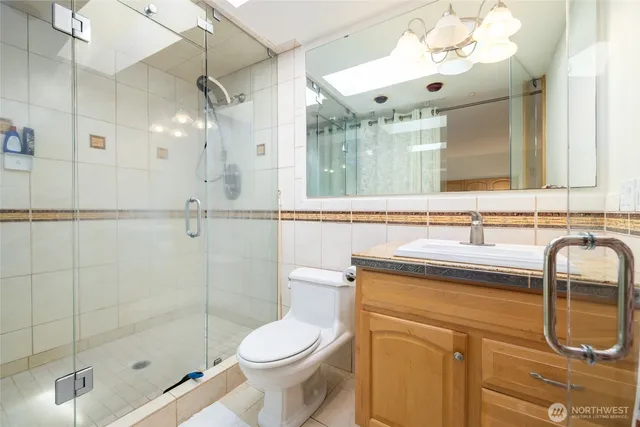 a view of a dining room with furniture large windows and wooden floor