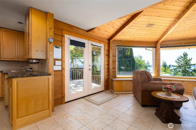 a balcony with furniture and a garden