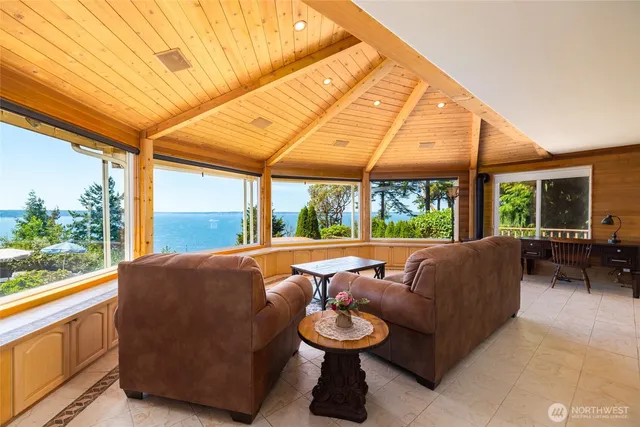 a view of a room with furniture and a window