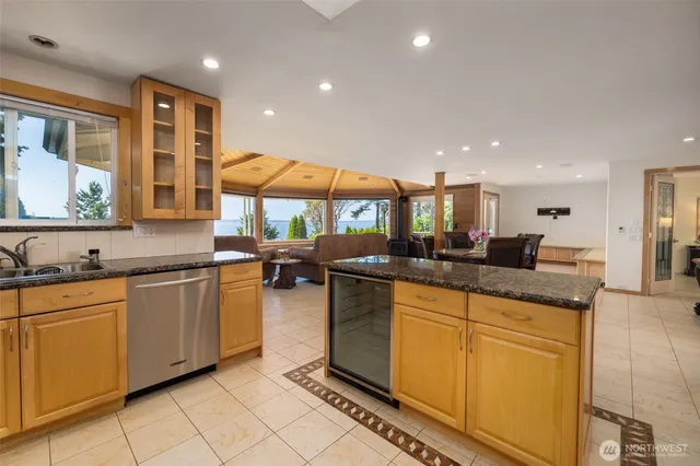 a kitchen with a stove a sink and a refrigerator