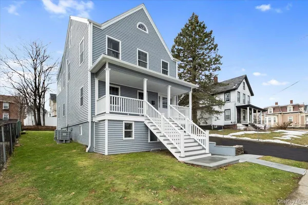 a view of a house with a yard