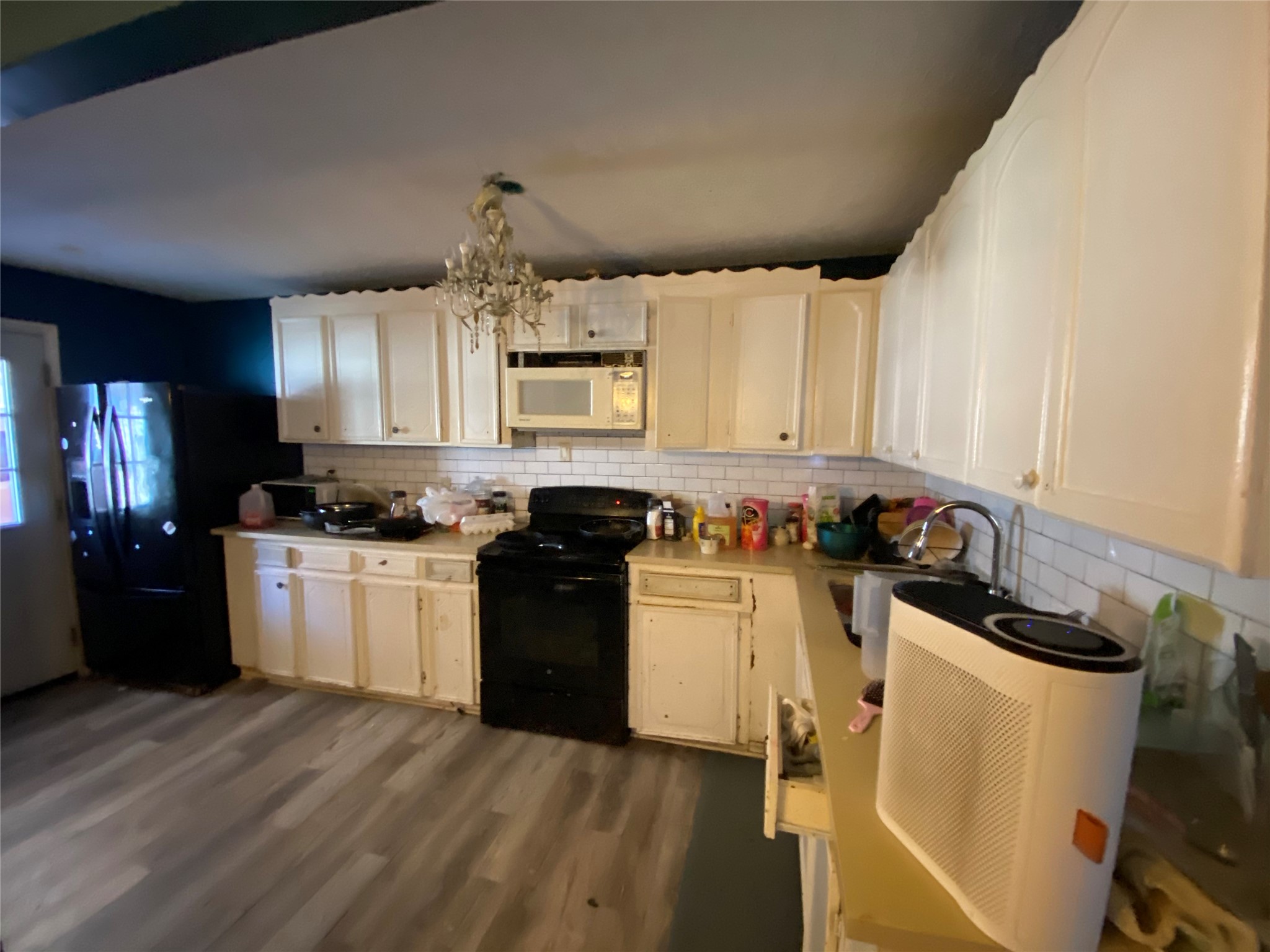 3147 Golfcrest Boulevard Houston, TX 77087 - Photo 13 of 27 a kitchen with granite countertop a refrigerator stove and sink