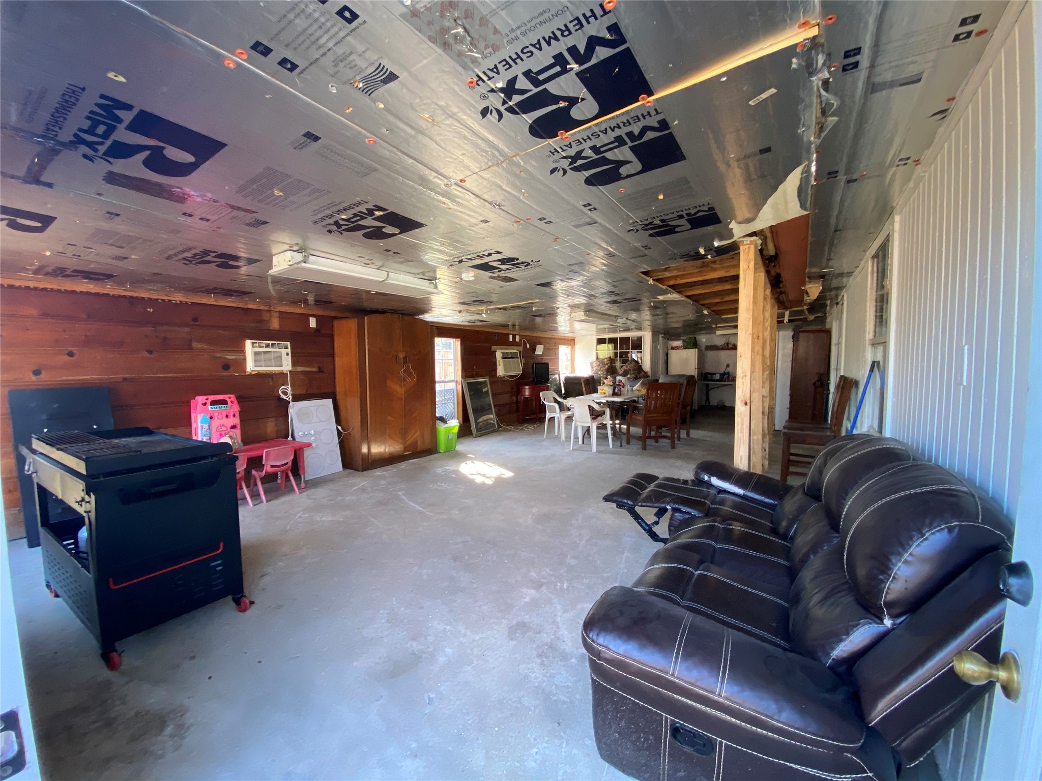 3147 Golfcrest Boulevard Houston, TX 77087 - Photo 16 of 27 a living room with furniture and a gym machine