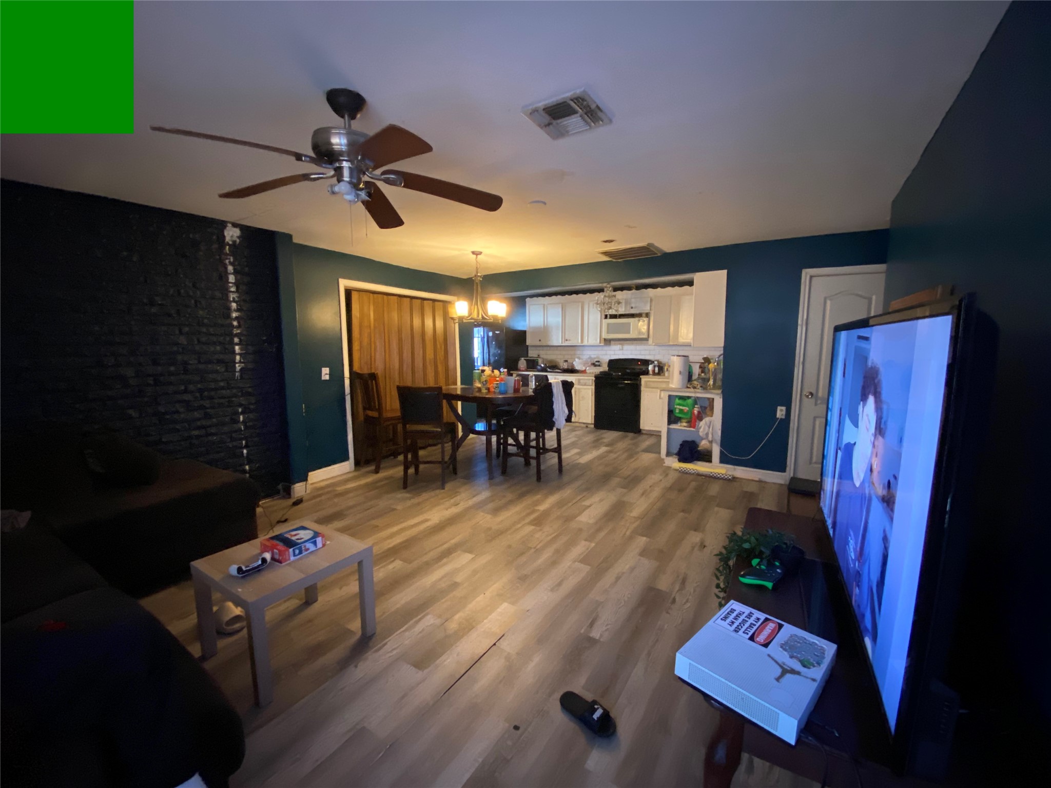 3147 Golfcrest Boulevard Houston, TX 77087 - Photo 4 of 27 a living room with furniture and a flat screen tv