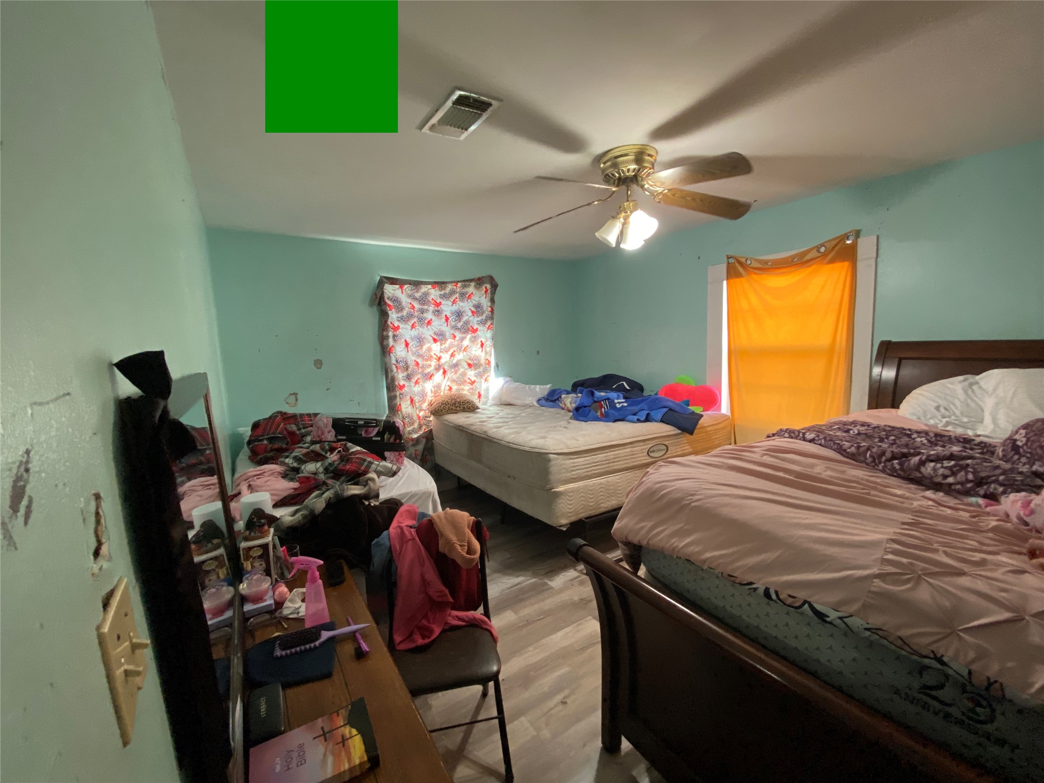 3147 Golfcrest Boulevard Houston, TX 77087 - Photo 10 of 27 a bedroom with bed and a chandelier
