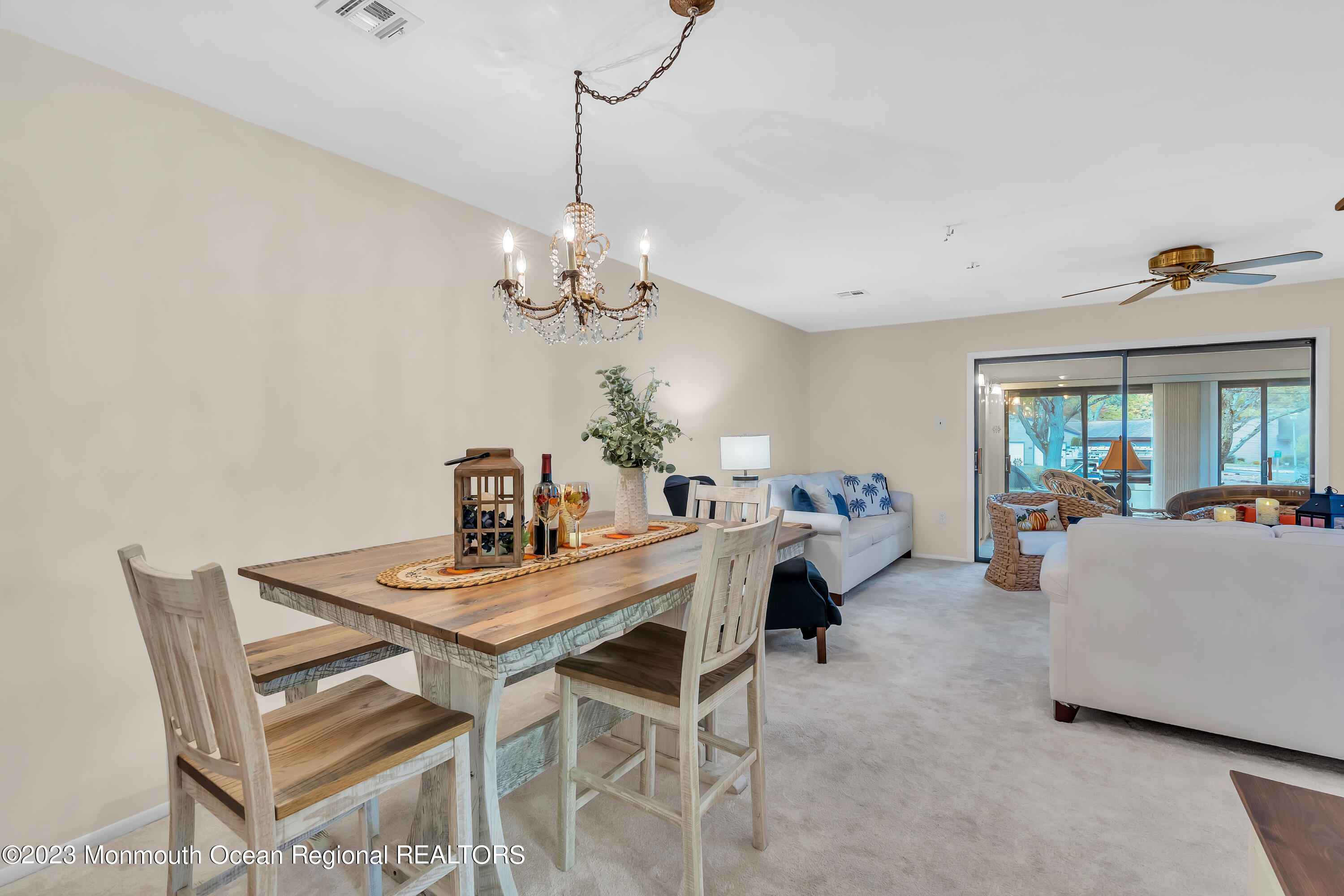 80 Friendship Court Red Bank, NJ 07701 - Photo 10 of 25 a living room with furniture and a chandelier