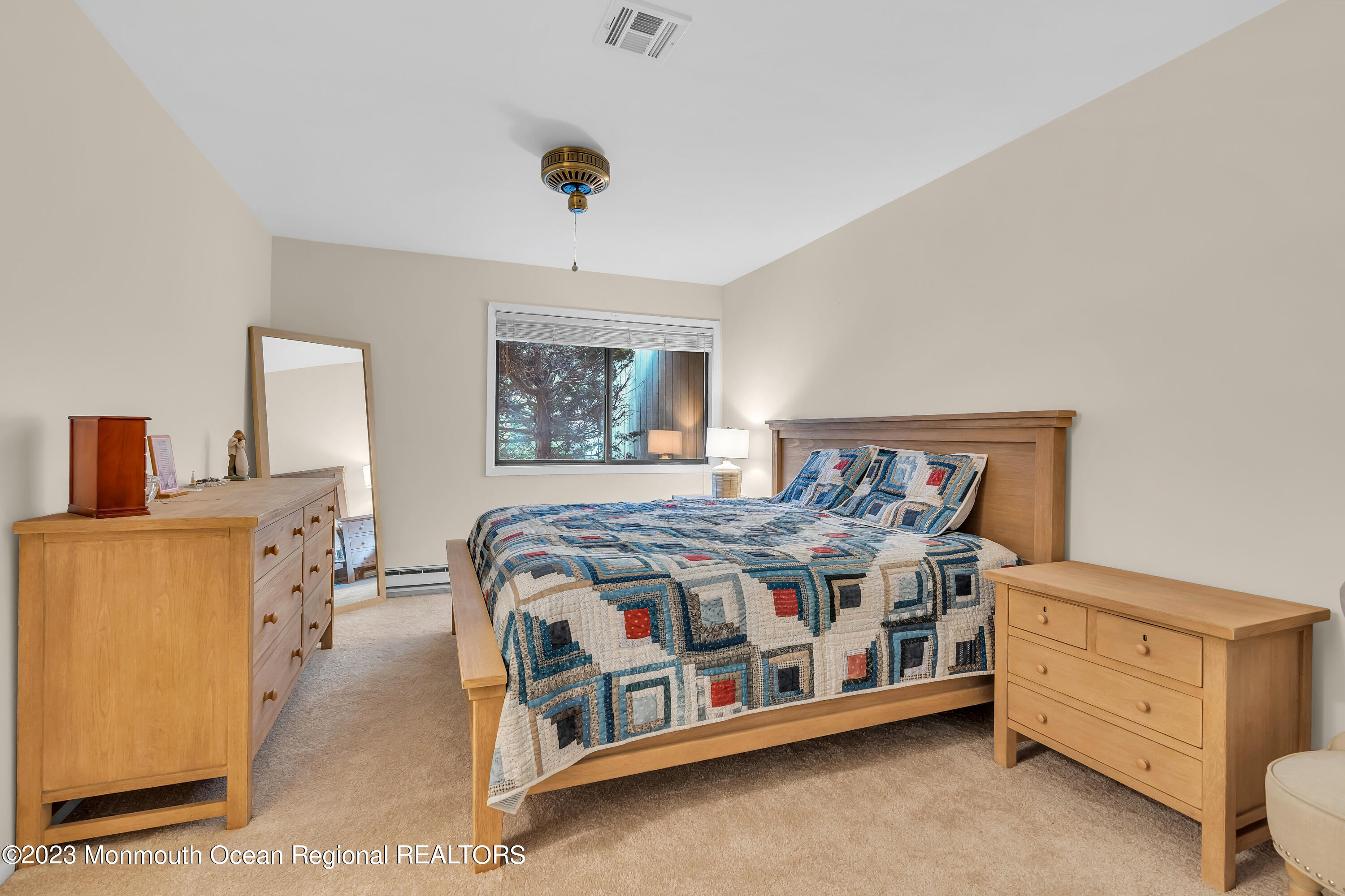 80 Friendship Court Red Bank, NJ 07701 - Photo 15 of 25 a bedroom with a bed and a dresser