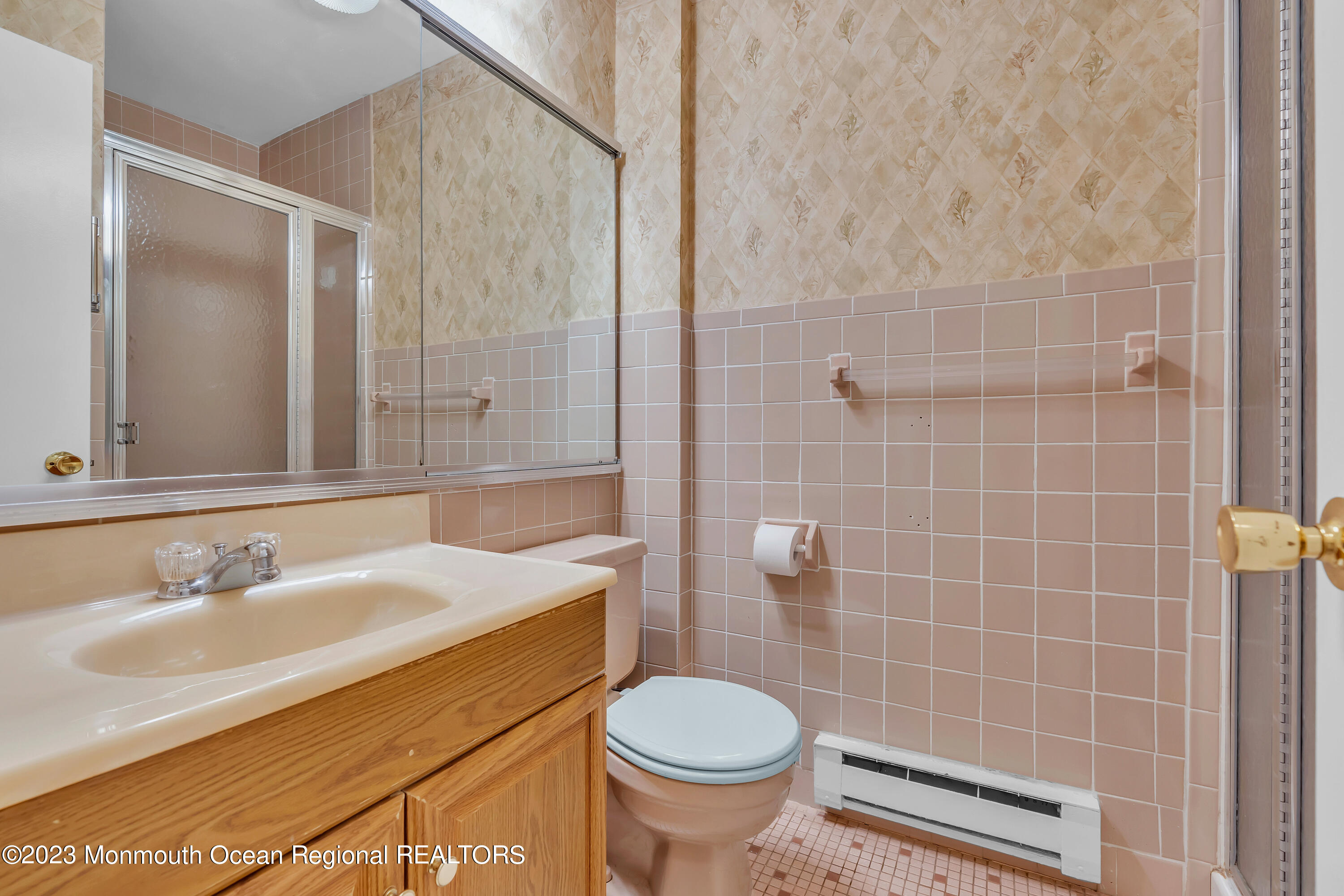 80 Friendship Court Red Bank, NJ 07701 - Photo 19 of 25 a bathroom with a sink a toilet and shower