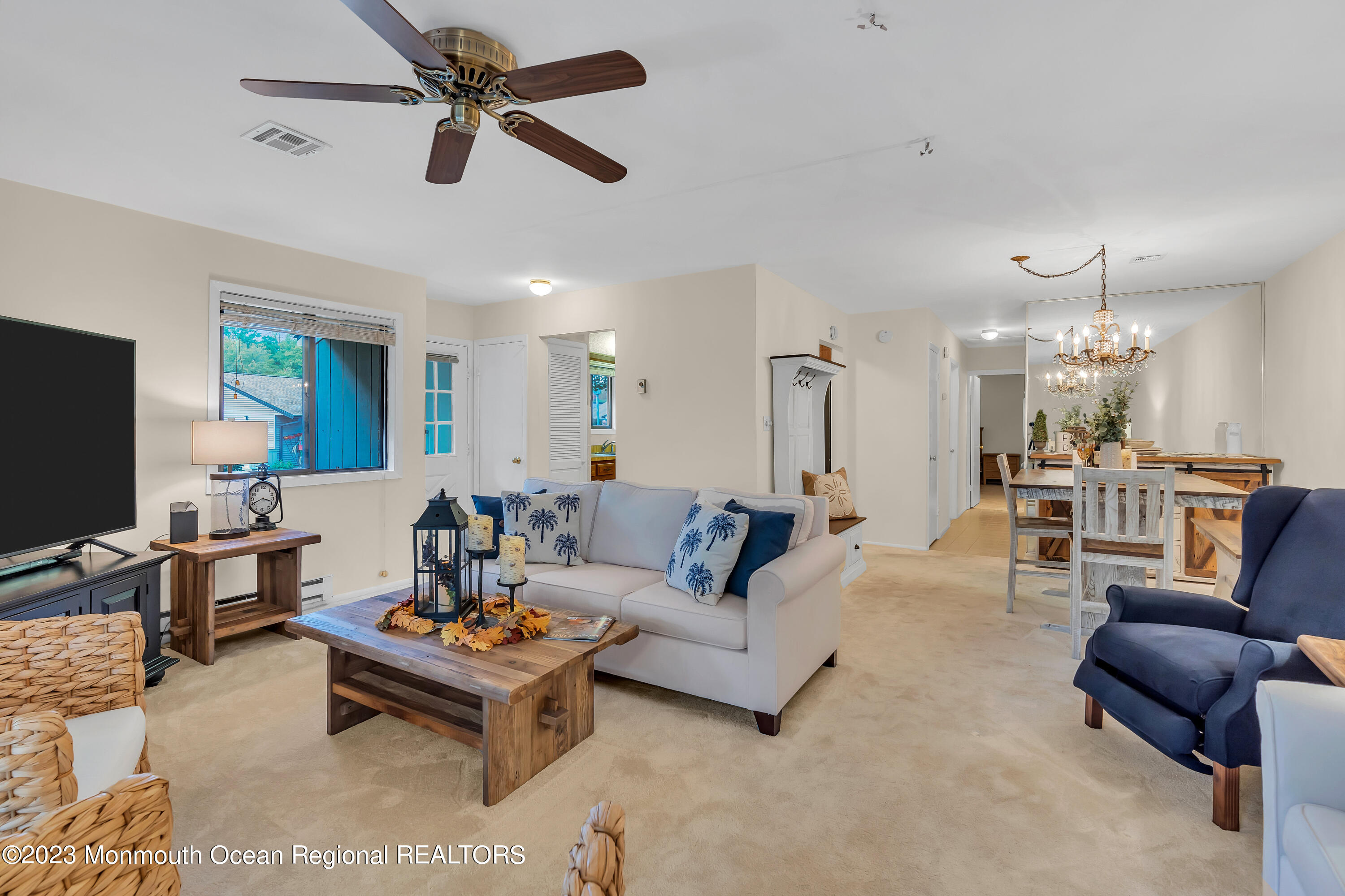 80 Friendship Court Red Bank, NJ 07701 - Photo 25 of 25 a living room with furniture kitchen view and a chandelier