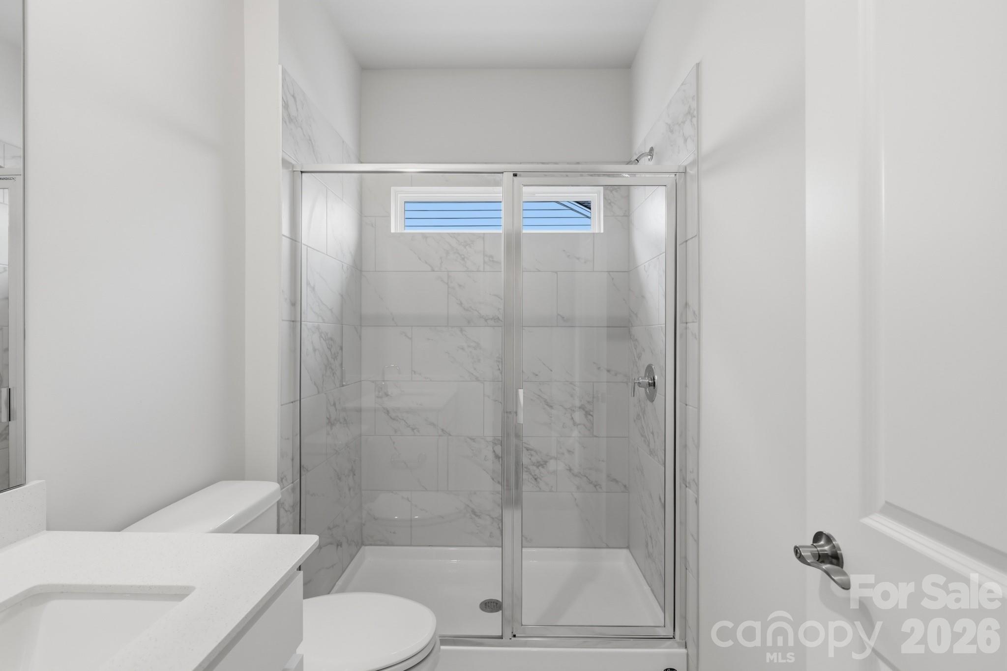 5450 Redbud Road, Unit 66 Lancaster, SC 29720 - Photo 26 of 35 a bathroom with a toilet and a shower