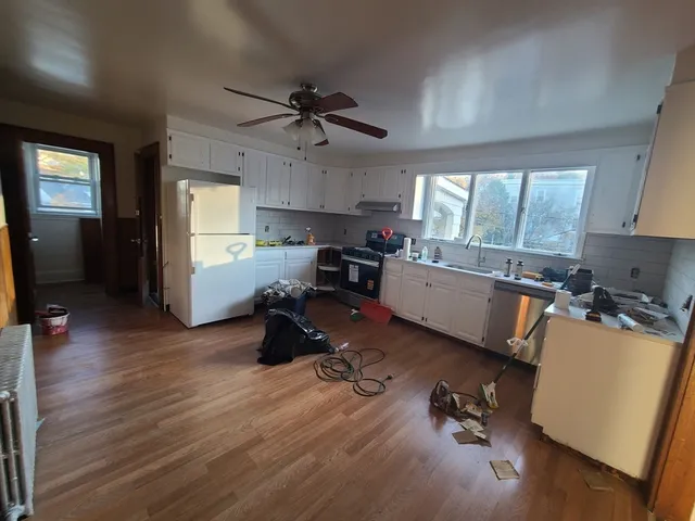 a view of a kitchen with workspace and a window