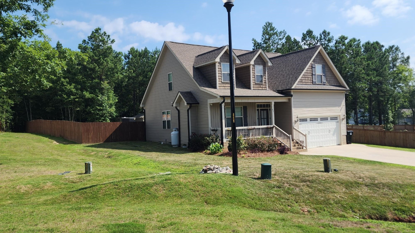 465 Redwood Road Zebulon, NC 27597 - Photo 3 of 3 a front view of a house with a yard
