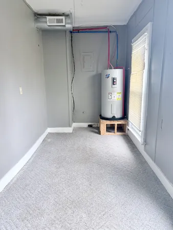 a view of an empty room with a fireplace