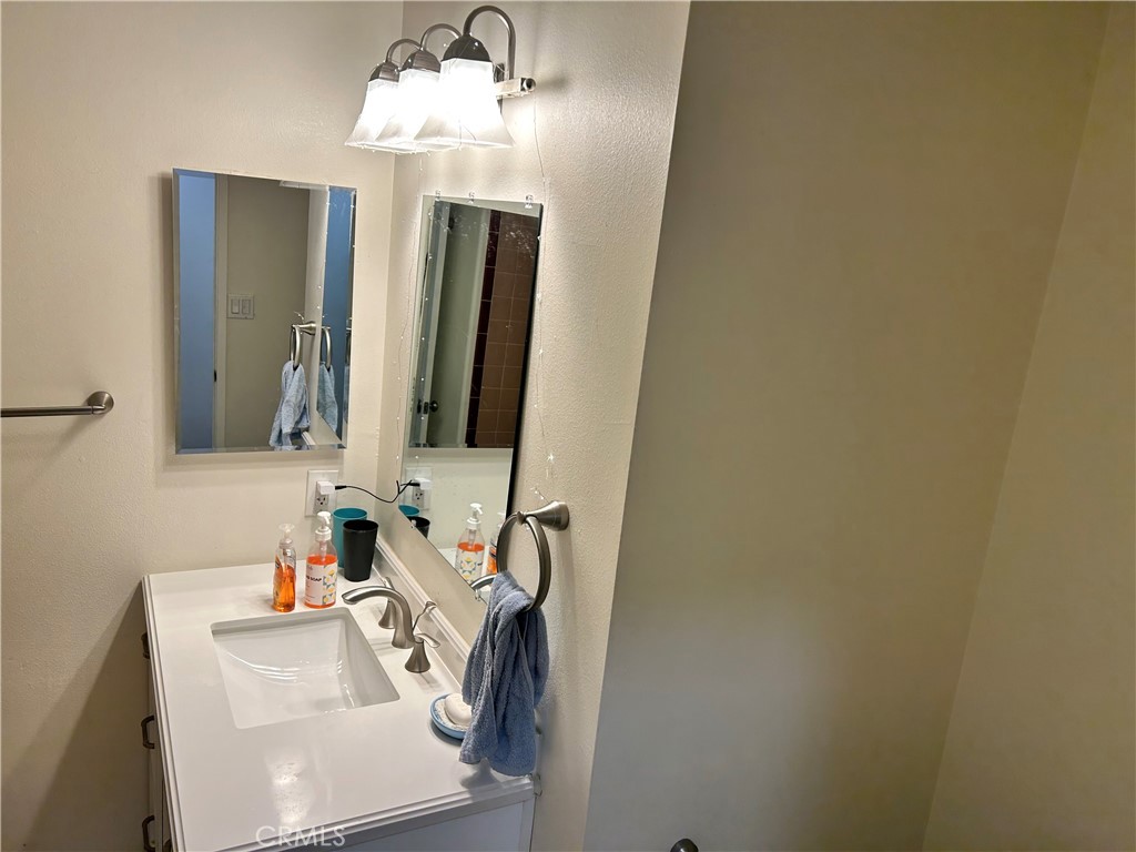 10443 Nate Way Santee, CA 92071 - Photo 15 of 27 a bathroom with a sink and a mirror