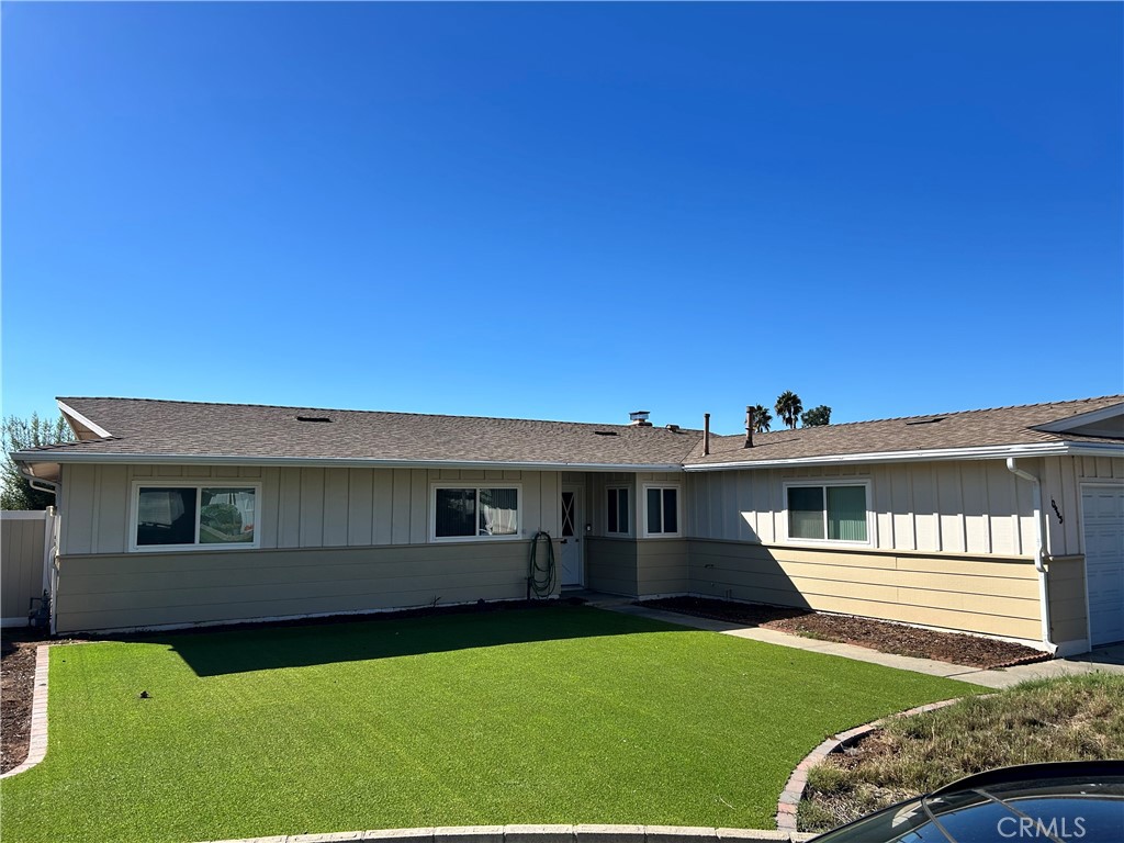 10443 Nate Way Santee, CA 92071 - Photo 2 of 27 a front view of a house with a garden