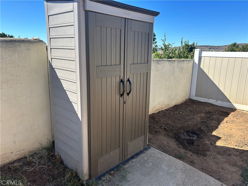 10443 Nate Way Santee, CA 92071 - Photo 21 of 27 a view of a house with a backyard