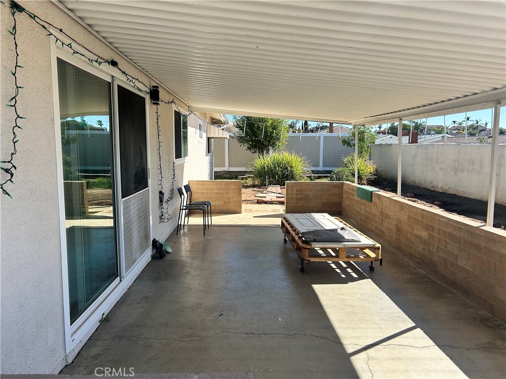 10443 Nate Way Santee, CA 92071 - Photo 22 of 27 a building outdoor space with patio furniture and potted plants