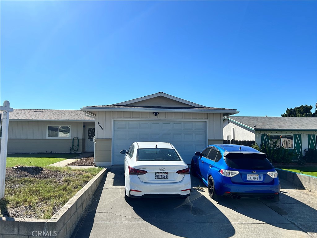 10443 Nate Way Santee, CA 92071 - Photo 26 of 27 a front view of a house with a garden
