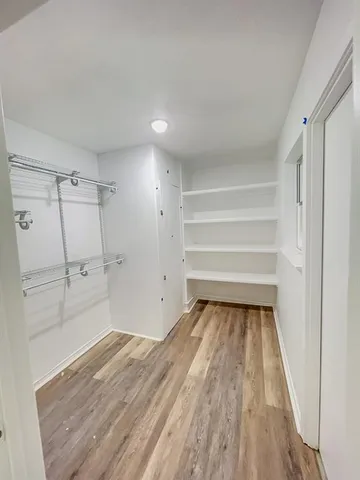a view of an empty walk in closet