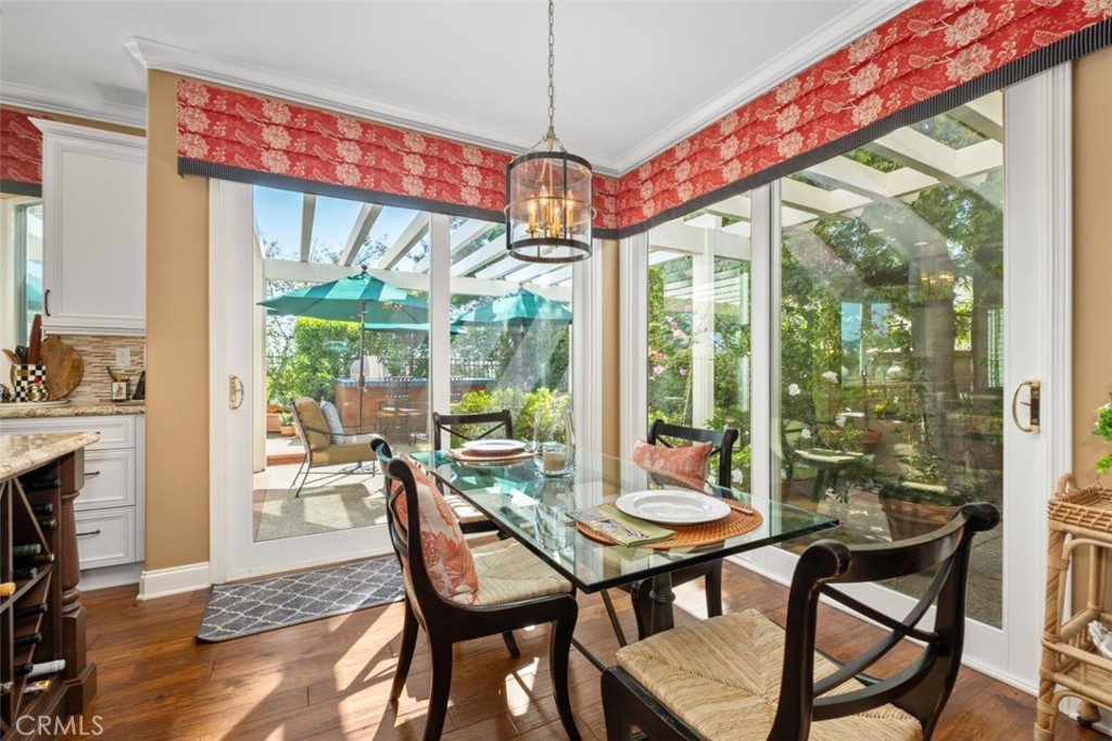 6 Muirfield Rancho Santa Margarita, CA 92679 - Photo 14 of 49 a view of a dining room with furniture large windows and wooden floor