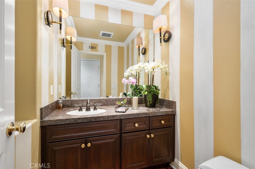 6 Muirfield Rancho Santa Margarita, CA 92679 - Photo 18 of 49 a bathroom with a sink and a mirror with toilet