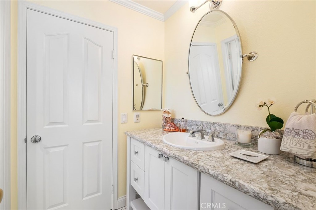 6 Muirfield Rancho Santa Margarita, CA 92679 - Photo 27 of 49 a bathroom with a double vanity sink and a mirror