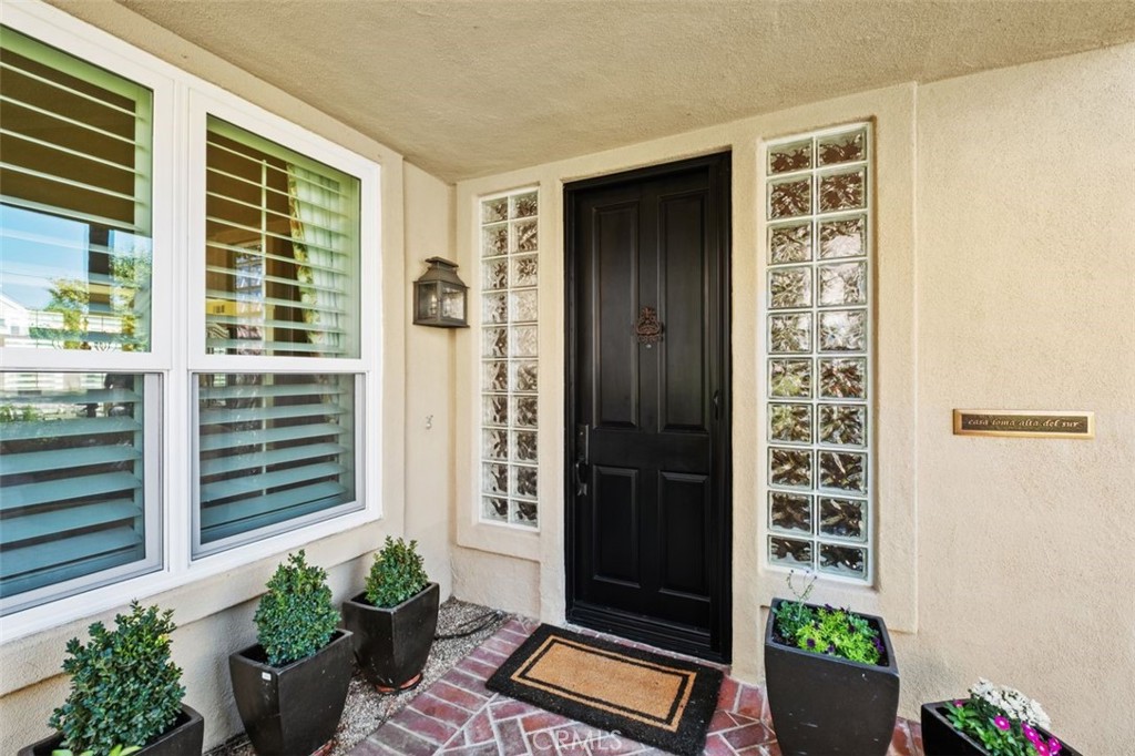 6 Muirfield Rancho Santa Margarita, CA 92679 - Photo 4 of 49 a front view of a house with potted plants