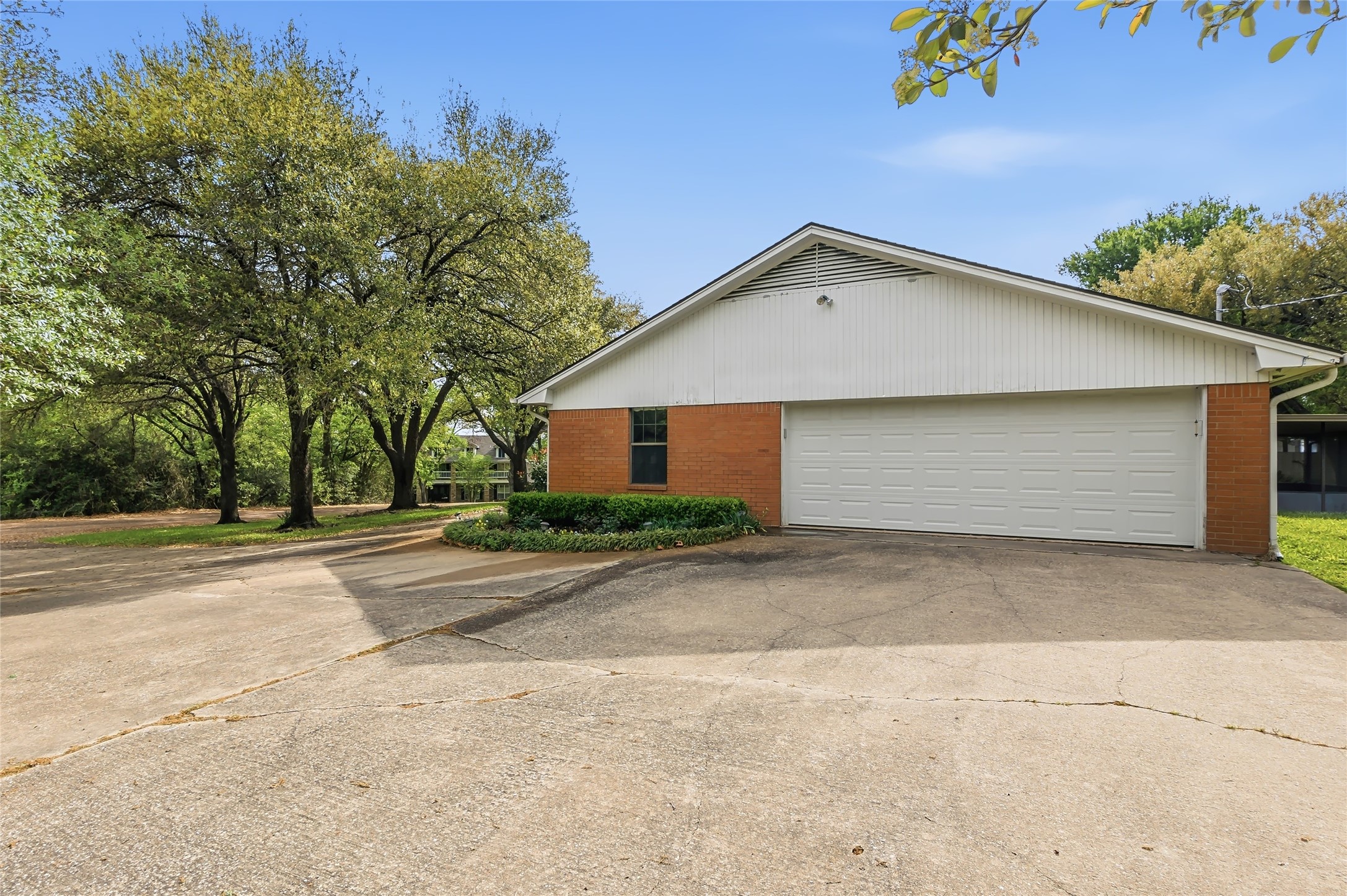 807 Standley Road Madisonville, TX 77864 - Photo 35 of 35 a front view of a house with a yard and garage