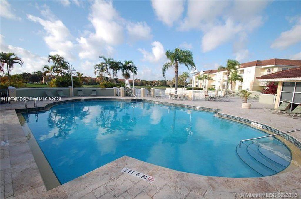 8650 Southwest 212th Street, Unit 101 Cutler Bay, FL 33189 - Photo 13 of 29 a view of a swimming pool